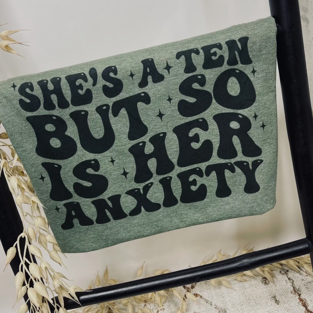 Green Graphic Tee with Black Text “ She’s a Ten But So Is Her Anxiety “